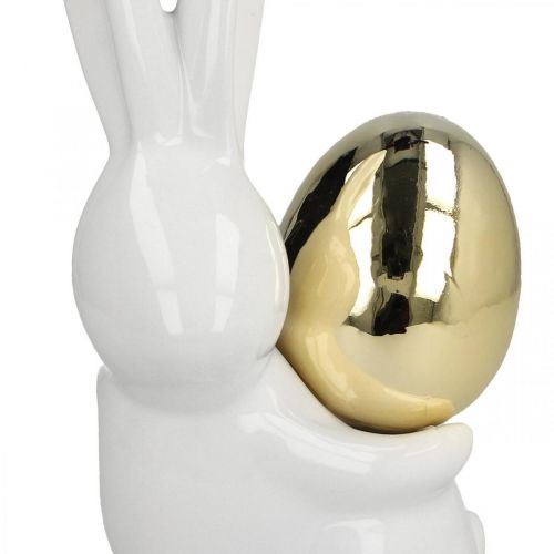 Itens Coelhinhos da Páscoa elegantes, coelhinhos de cerâmica com ovo dourado, decoração de Páscoa branco, dourado Alt.18cm 2 unidades